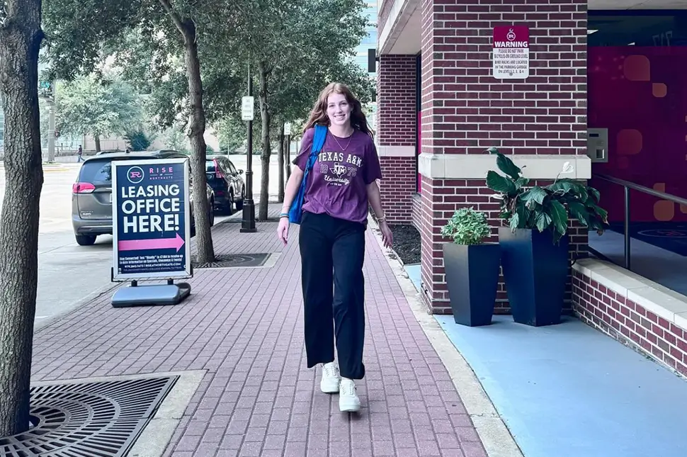 young woman walking to class